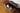 Photo of Kitel - black and white cat on a cat sized lounge - business owner's cat