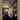 regal dilute tabby point Siamese cat sits on the back of a couch