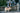 When should you call your veterinarian? - Man on the phone on a park bench with his dog.